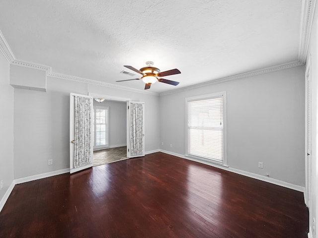 unfurnished room featuring crown molding, a healthy amount of sunlight, wood-type flooring, and ceiling fan