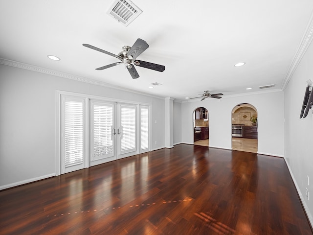 unfurnished living room with ornamental molding, french doors, ceiling fan, and dark hardwood / wood-style flooring