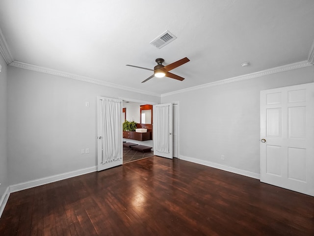 empty room with crown molding, dark hardwood / wood-style floors, and ceiling fan