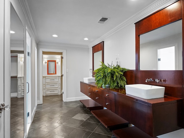 bathroom with vanity and crown molding