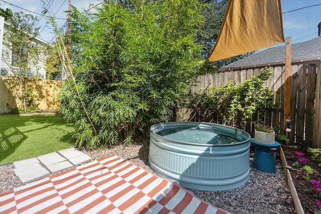 view of patio / terrace featuring a jacuzzi