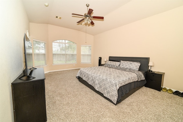 bedroom with ceiling fan, vaulted ceiling, and light colored carpet