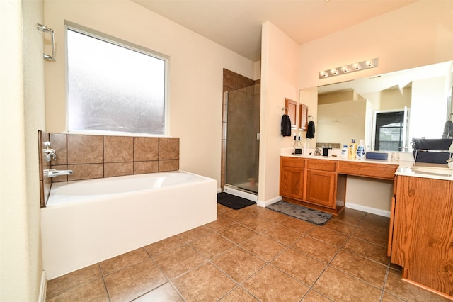 bathroom with vanity, independent shower and bath, and tile patterned flooring