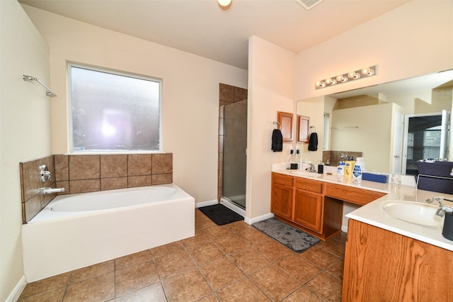 bathroom featuring vanity, tile patterned flooring, and plus walk in shower