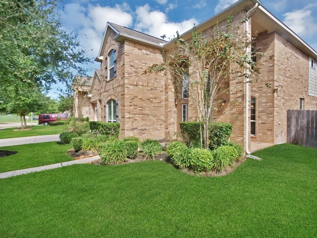 view of side of property with a yard