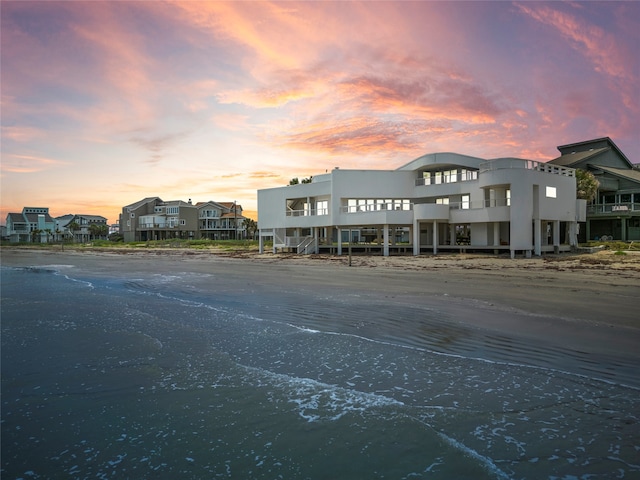 view of outdoor building at dusk