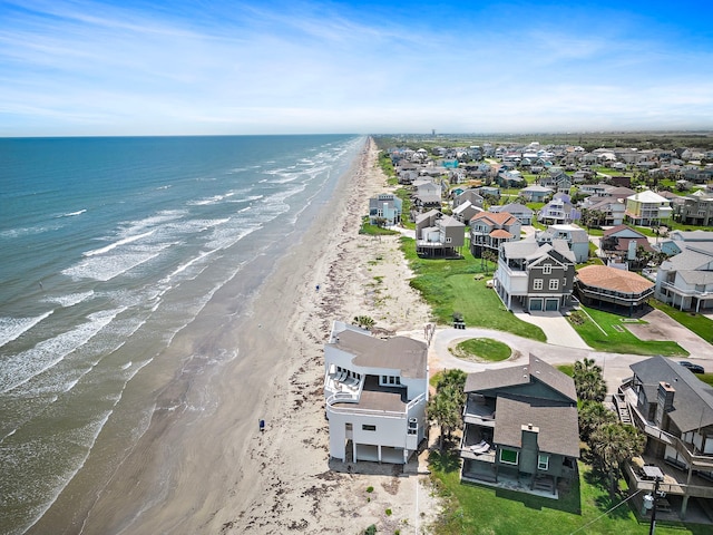 aerial view featuring a water view and a beach view