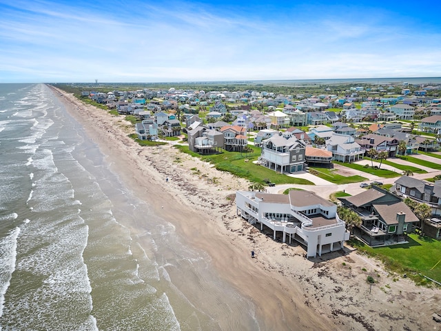 bird's eye view with a water view and a view of the beach