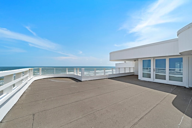 view of patio with a water view