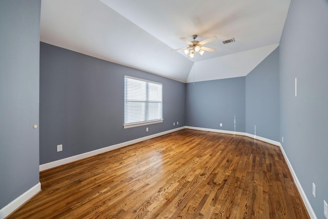 unfurnished room with ceiling fan, wood-type flooring, and vaulted ceiling