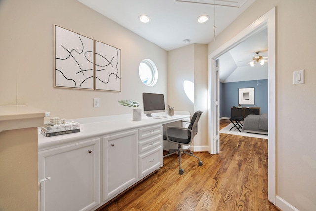 office space featuring light hardwood / wood-style flooring and vaulted ceiling