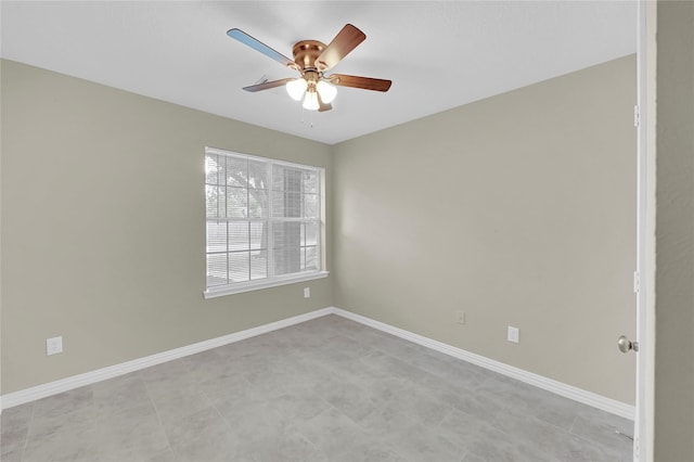 spare room with ceiling fan