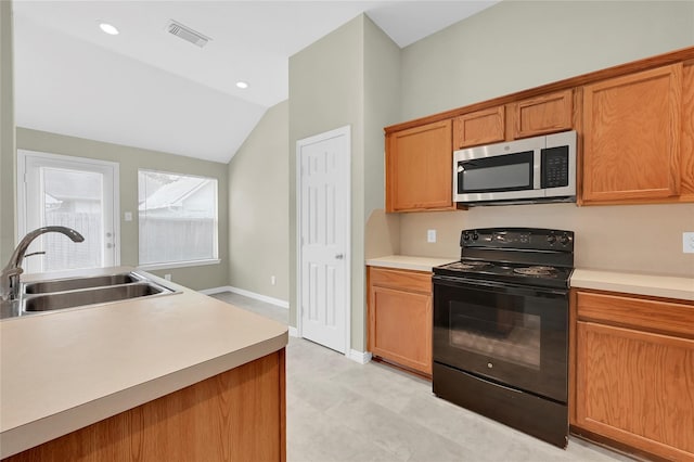 kitchen with black range with electric stovetop, sink, and vaulted ceiling