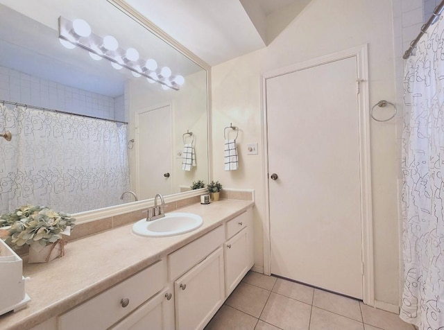 bathroom with tile patterned flooring and vanity