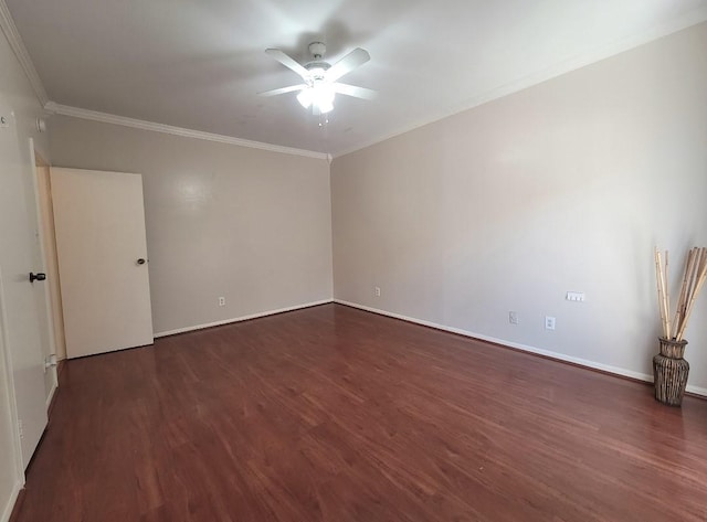 spare room featuring dark hardwood / wood-style floors, ceiling fan, and ornamental molding