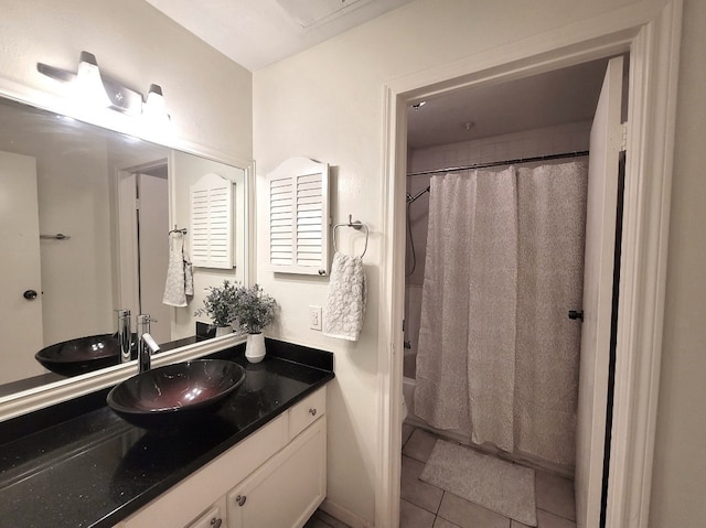 bathroom featuring vanity, tile patterned floors, and shower / bath combo with shower curtain