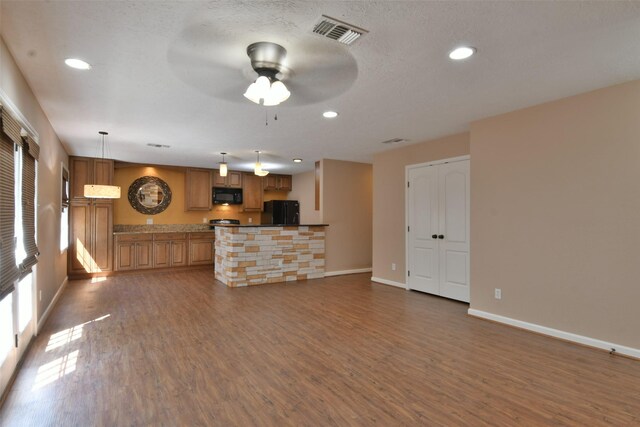 809 Pecan St, Brenham, TX 77833 - unfurnished living room featuring dark wood-style floors, baseboards, a ceiling fan, and recessed lighting
