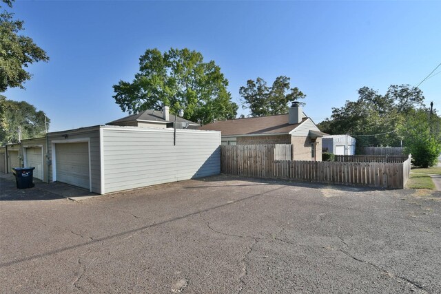 809 Pecan St, Brenham, TX 77833 - garage featuring fence