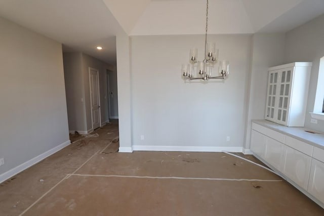 unfurnished dining area with a chandelier