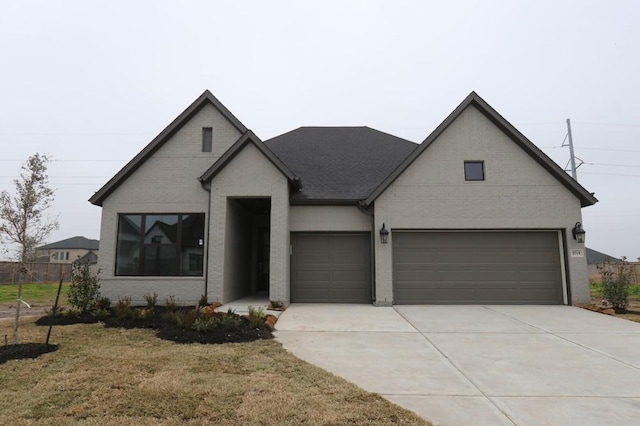 view of front facade with a garage and a front yard