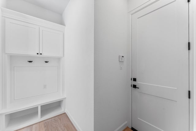 mudroom with light hardwood / wood-style floors