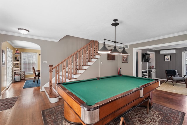 rec room featuring hardwood / wood-style floors, crown molding, billiards, and an AC wall unit