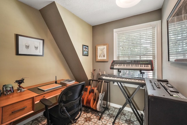 home office featuring a textured ceiling