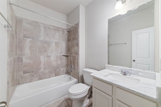 full bathroom with vanity, toilet, tile patterned floors, and tiled shower / bath combo