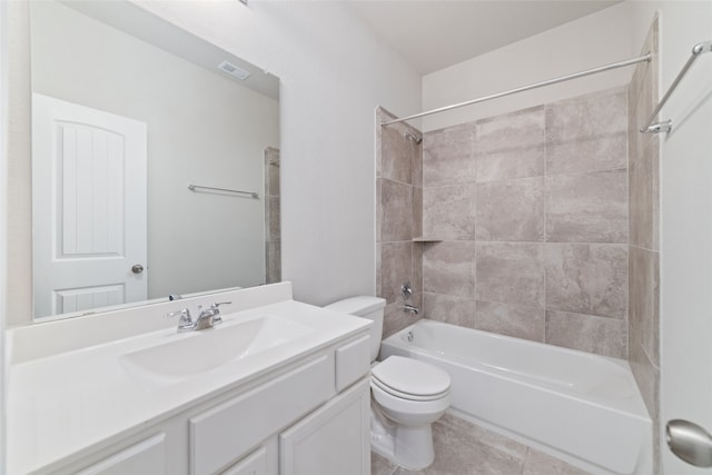 full bathroom with toilet, tiled shower / bath combo, vanity, and tile patterned floors