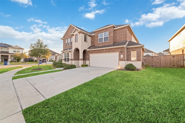 view of front of property with a front yard and a garage