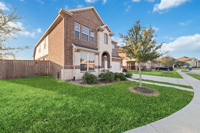 view of front facade featuring a front lawn and a garage