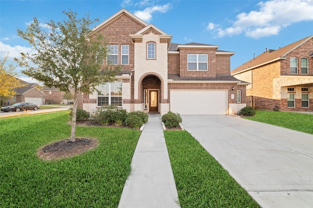 view of front of house with a front lawn and a garage