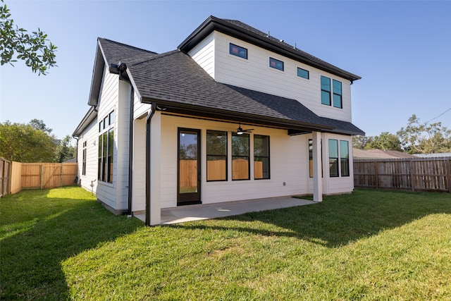 back of property featuring a patio, ceiling fan, and a lawn