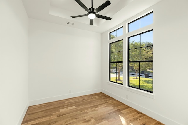 spare room with light hardwood / wood-style floors and ceiling fan