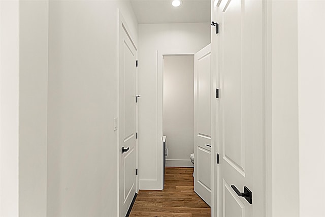 hallway featuring dark wood-type flooring