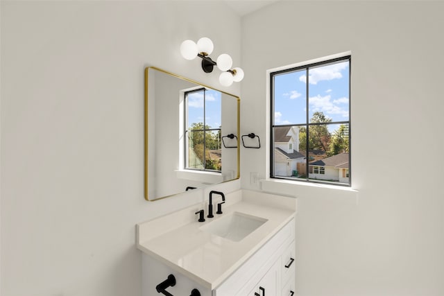 bathroom with vanity and plenty of natural light