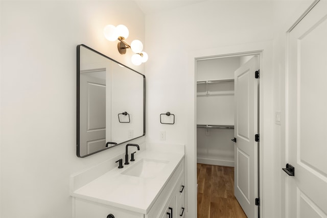 bathroom with vanity and hardwood / wood-style floors