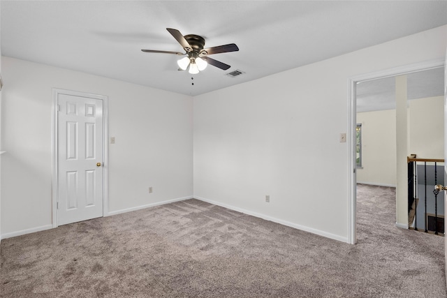 unfurnished room with ceiling fan and carpet flooring