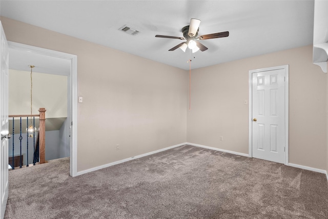 unfurnished room with carpet and ceiling fan