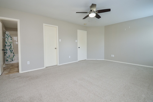 unfurnished bedroom with baseboards, ceiling fan, and carpet flooring
