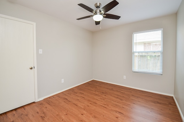 unfurnished room featuring hardwood / wood-style floors and ceiling fan