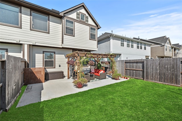 rear view of house with a pergola, a lawn, a patio, and an outdoor hangout area