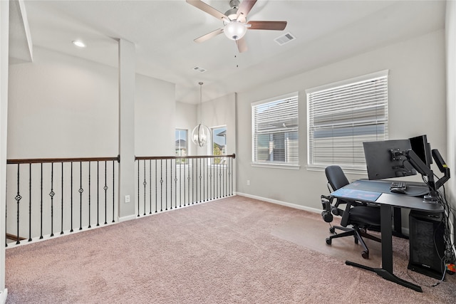 office area with carpet and ceiling fan with notable chandelier