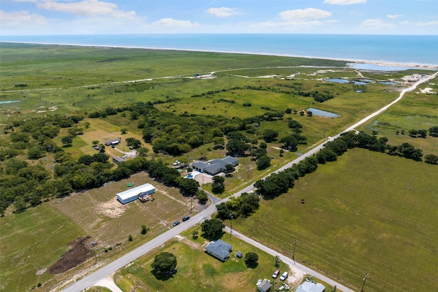 bird's eye view with a water view and a rural view