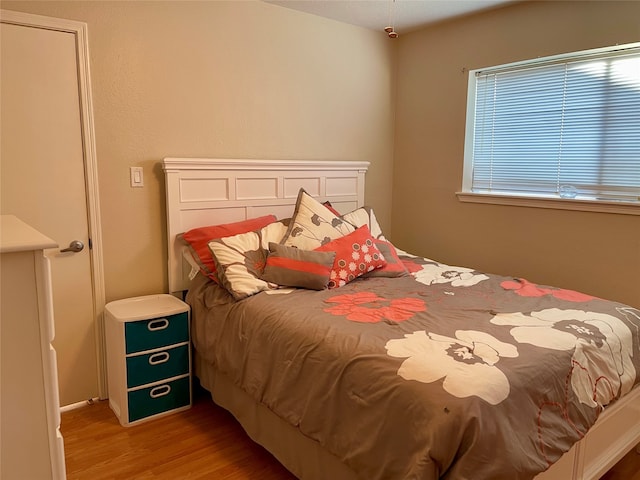 bedroom featuring hardwood / wood-style floors