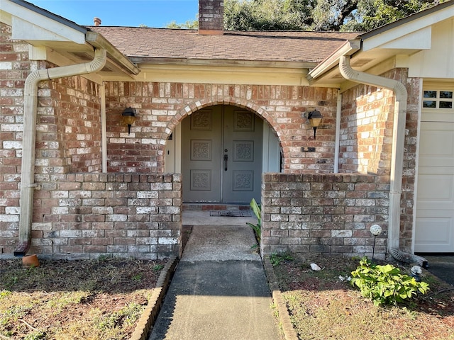 entrance to property featuring a garage