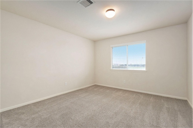 spare room featuring carpet flooring