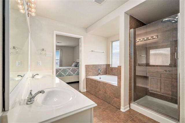 bathroom with tile patterned flooring, plenty of natural light, and sink