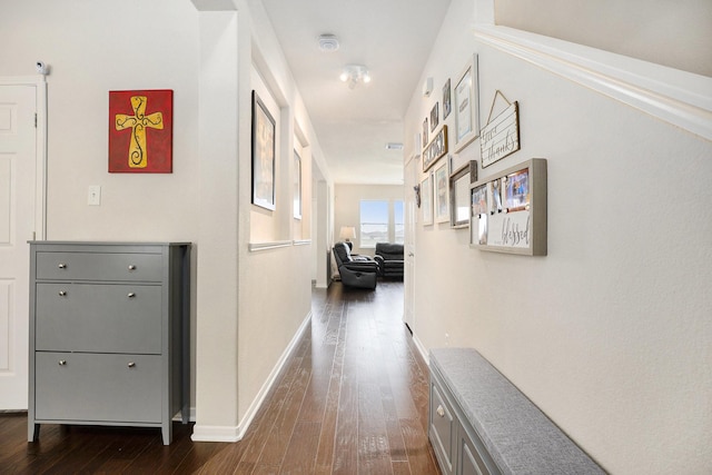 hall with dark wood-type flooring