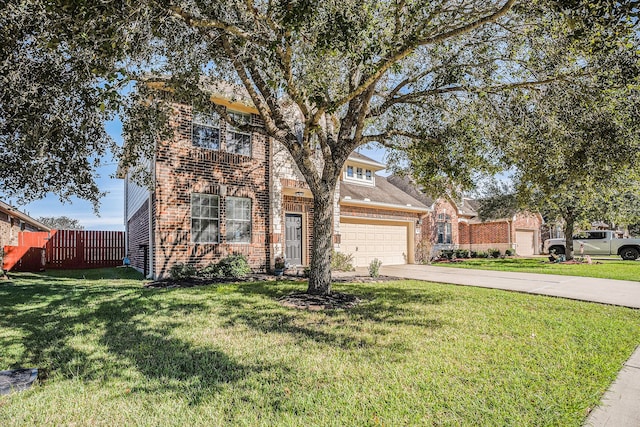 view of property featuring a garage and a front yard